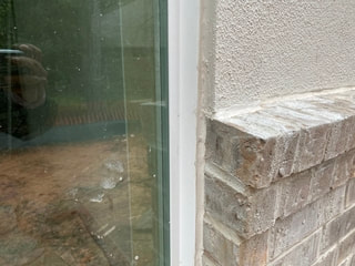 caulk at window stucco & brick
